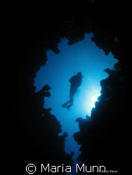 The Canyon in Dahab with the Dive Guide finning backwards... by Maria Munn 